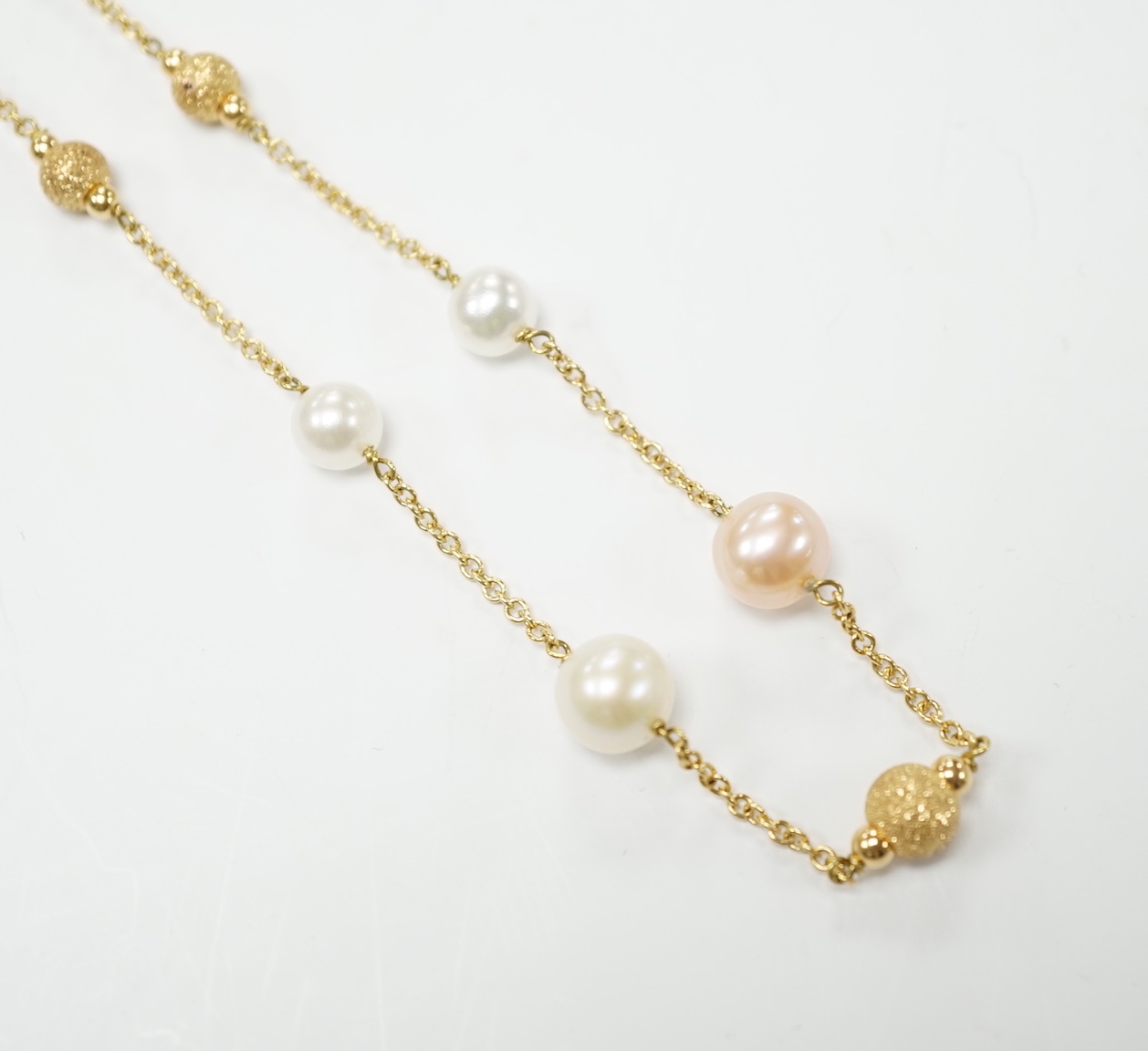 A modern Italian 18ct gold, twelve stone two colour cultured pearl and five gold sphere set necklace, 48cm, gross weight 13.4 grams.